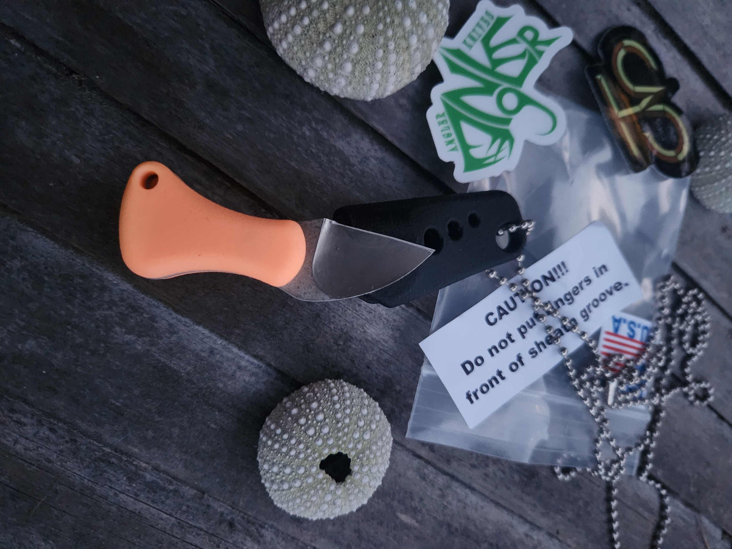 Turner CNC Anchovy - Orange glow handle black sheath