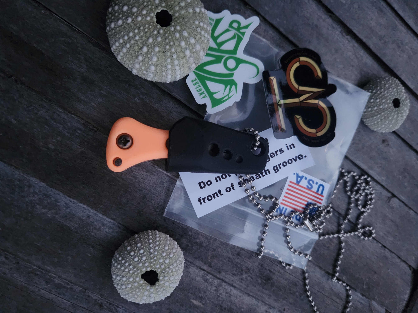 Turner CNC Anchovy - Orange glow handle black sheath