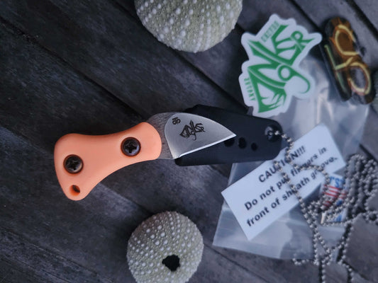 Turner CNC Anchovy - Orange glow handle black sheath